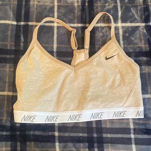 Nike nude cross back sports bra size Large.